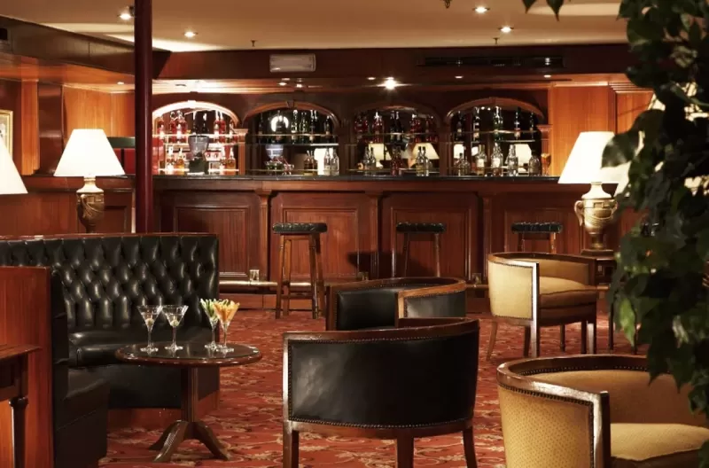 Relaxing in the lounge aboard Jaz Crown Jewel Nile Cruise – cocktails with Nile backdrop